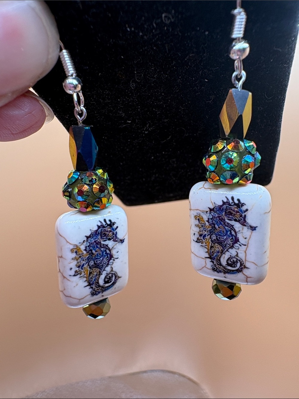 Hand Crafted White Bead Seahorse Earrings with Iridescent Green-Gold Accents